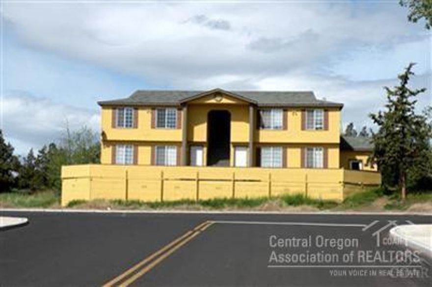 Investors take Note! 100% occupied! Increase of rental rates October 1 to $2900 per month providing a great cash flow! Professionally managed. Great location not far from shopping & schools. Great steady income & some units are under rented, so, the income could be even better! Each unit has a large kitchen, private patios or decks on the back & a large composite deck on the front & the building has an attached laundry room for potential extra income. Parking for 8+ cars, all on a large .3 acre lot.