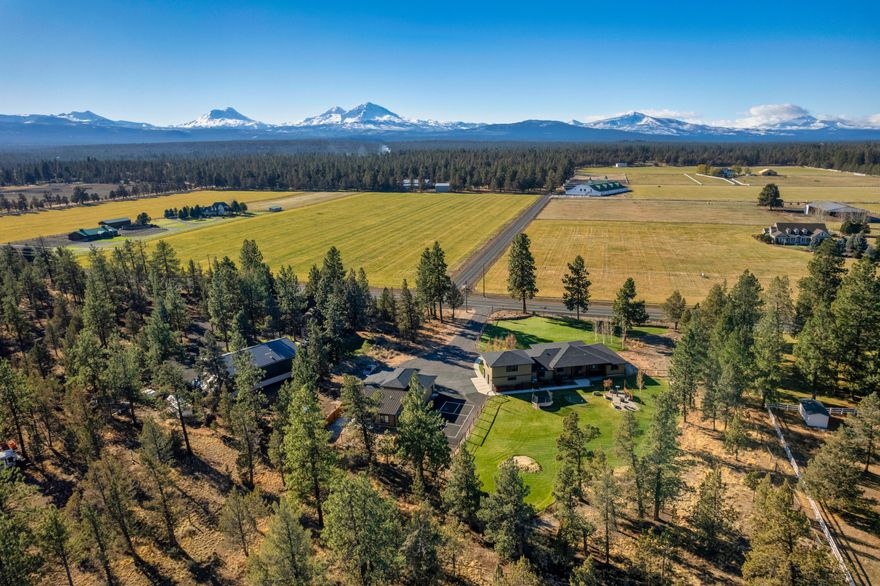 One of a kind, builders own custom home on 2.7 flat acres.  Rare find with breath taking unobstructed views of 5 peaks.  Current appraisal (11-4-22) on file.  Cloverdale is in a perfect location to access all that Central Oregon has to offer, just 4 miles to Sisters and 14 miles to Bend. Designed for easy open living both inside and out.  This highly energy efficient home has mini splits throughout for inexpensive heating and cooling, with a forced air furnace as back up which is rarely needed.  Main house has 3475 sq. ft. of open floor plan living, huge laundry / craft room, gourmet kitchen, and must see amenities.  ADU with 593 sq. ft. includes 1 bedroom, living room, full kitchen, laundry, and electrical meter for long term rental or Air B n B. Total living space 4068 sq. ft.  3 Bay shop large enough to store your RV. Full hookups for your RV friends to visit.  Two large covered patios, along with putting green and pickleball court.  Fully fence front and rear yards.