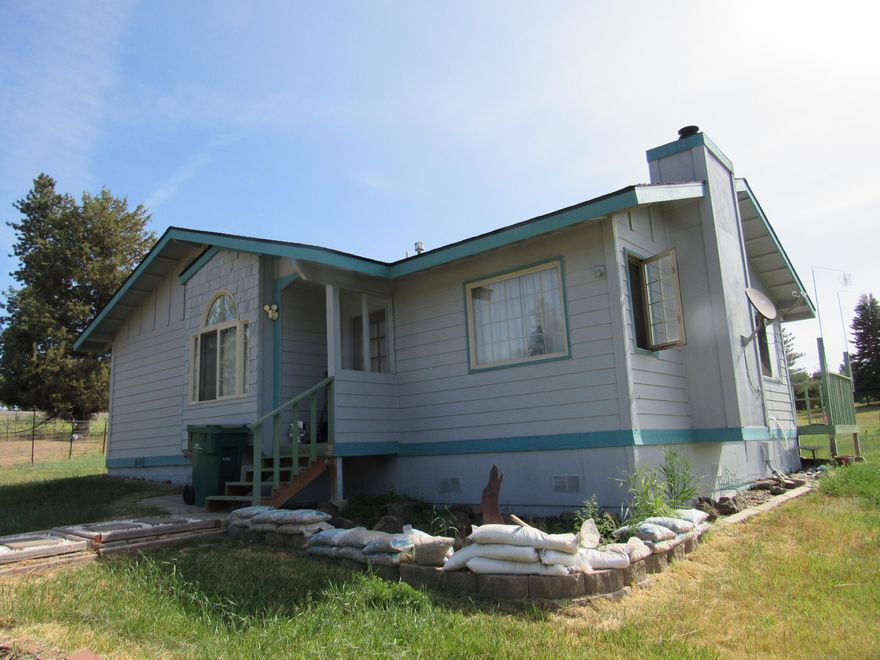 This home sits on one acre with room for a horse if you so want!! The home is smaller but charming with 2 bedrooms & 2 bath. There is access to the famous Williamson River for fishing, kayaking or maybe launching a small boat. There is a garage-- and the home recently had a new roof installed and was painted. There is a nice cozy wood stove for those cold days and nights.  School bus stop is close by.  This property is within 30 or so miles to Crater Lake National Park and is in the heart of fishing, camping, hunting, hiking or just the quiet way of life.