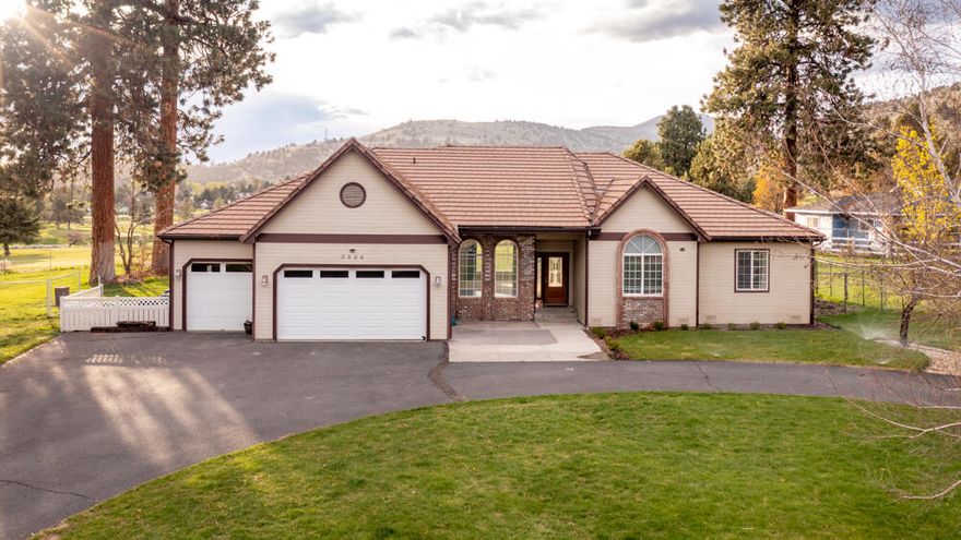 This stunning one story home is on 1+ acres in a sought after neighborhood just outside of town. From the open-concept kitchen and living space to the large backyard featuring mature trees, there is plenty of room for the whole family to enjoy. A substantial amount of natural light shines through the large windows in the kitchen which features granite countertops and stainless steel appliances. Take a break and relax in the separate great room. A French door in the primary bedroom allows access the back deck. The double vanity is brand new in the primary bathroom next to the jetted tub! Sit on the large deck in the backyard and enjoy the views of Shield Crest Golf Course and the mountains in the background. RV parking is available in addition to the 3 car garage and circular driveway. Schedule a tour today!