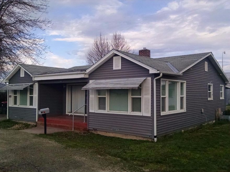 This multi-family or investment property has 3 separate homes, huge shop, barn and sits on 4.4 acres. The main home (1284 Sqft.) is a 3 bedroom/1 bathroom with living room, dining room and kitchen (there is hardwood floors under carpet). The other two homes each have a carport. One home is 775 Sqft and the other is 425 sqft. Behind all the homes you will find a huge two story shop, barn and 4.4 acres. There are two wells on the property and irrigation rights. The irrigation ditch runs right on the side of the property. Great views of the Table Rocks. The well tested at 7.5 gallons per minute (12/29/2015). Homes need a little TLC but very hard with this set-up and location.