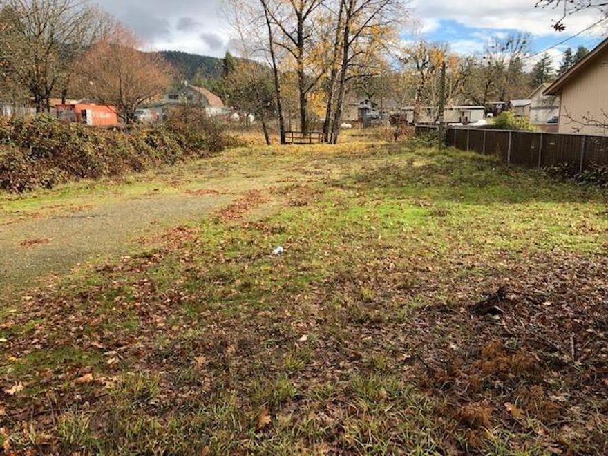 Nice level lot ready for your business. It is at a great location, near the heart of downtown Cave Junction, with many uses available outright. There are not many commercial lots still available within the Cave Junction City Limits. This one has city water, sewer and other utilities already available. Be sure & check with the City of Cave Junction on the types of allowed uses. Due diligence is encouraged. Although this lot is intended for business, a residence is also allowed if it is in conjunction with a business.