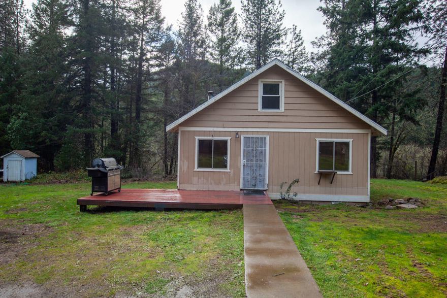 Seller may carry with acceptable down payment.  Cute little Country cottage. 1.05, level, wooded acreage.  Nice sized kitchen,  Living room gets lots of natural light.  2 bdm, 1 ba with large room in attic that could potentially be another bedroom.  This home is quite a ways off highway with lots of trees between home and hwy.  This home will qualify for all loan programs.