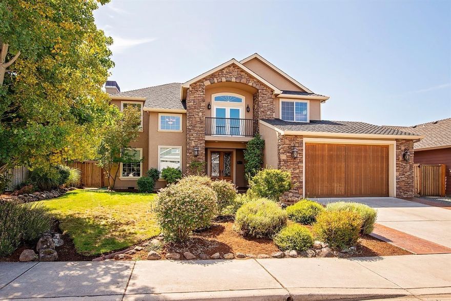 Gorgeous Tuscan style home featuring 2930 sq. ft, four bedrooms and 2 full bathrooms/2 half bathrooms. As you enter through the beautiful leaded glass double door you will notice 20' ceilings in the living room, edged with crown molding. The entryway has a gorgeous inlaid slate carpet surrounded by hardwood floors. The living room has a beautifully crafted slate and travertine gas fireplace that is in itself a piece of art. There kitchen has slab granite counters with chiseled edges, stainless steel appliances, and custom cabinets. The first floor master bath has a dual headed shower and a jetted tub, lovely fixtures and stone work. Also downstairs you will find an option 4th bedroom/office/ den. Upstairs you will find two additional rooms with granite topped desks. each of these rooms are seperated by a Jack and Jill style bathroom. Covered patio off kitchen, built-in vacuum system, oversized garage, stamped concrete driveway.