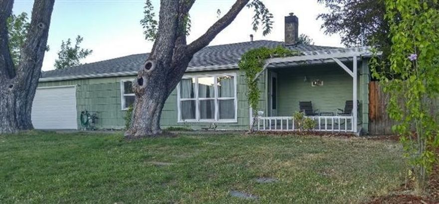 The perfect home with charm and character. This 1823 sq ft home has 3 bedrooms 2 bathrooms with an extra office or bonus room. The large living room is bright with lots of natural light. It has gorgeous hardwood floors, crown molding and a gas fireplace. The kitchen has plenty of space, lots of storage and updated flooring. The hardwood floors carry into the dining room and the bonus room. The master bedroom fits a king size bed with ease and has closet organizer. The back yard is large with an enormous covered deck with built in planters and mature trees. The driveway has plenty of space for several cars and has a 2 car finished garage with a new garage door. This home has a forced air heat and AC system. All updated vinyl windows, large laundry room. The home is located on a dead-end street and is in the Oak Grove school district.