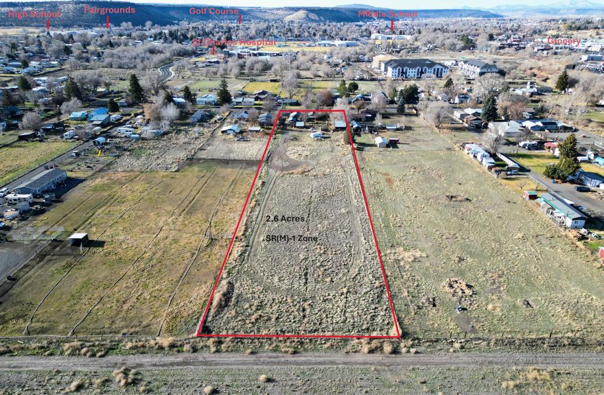 Rare Opportunity: Nearly 3 Acres Inside the UGB! Attention investors, builders, and developers! This versatile property in Prineville offers a wealth of possibilities. Secure your 2026 projects now. Zoning, SR(M)-1 (Suburban Residential Mobile zone), the site is prime for a minor partition to create additional parcels for new single or multi-family dwelling(s)  

The property features an existing home, garage, and barn that can be renovated for immediate rental income or lived in while planning your development. Alternatively, clear the site to build your custom stick-built home, manufactured home and/or ADU. A new well was drilled in June of 2023, producing a strong 10 GPM (see attached docs).   

Buyers responsible for all due diligence i.e. building, developing, approved zoning uses, utilities, etc. Check w/Crook County Planning Dept.  AS-is, cash sale.