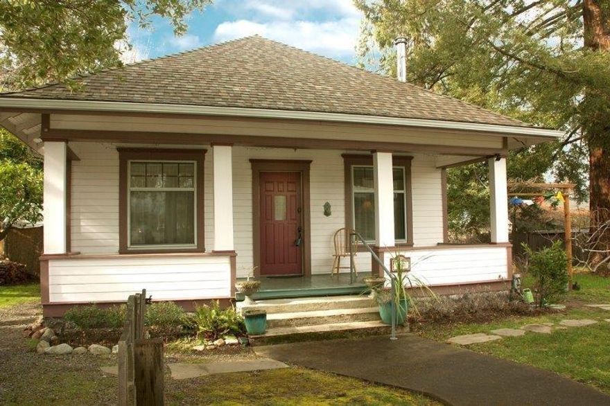 Where you want to live . . . in the sought-after downtown area close to theaters, restaurants, Ashland Food Co-openjoying historic Thaddeus Powell House, still true to its beautiful historic design. This solid well-cared-for 1248 sq ft charmer has 10-foot ceilings, original Arts & Crafts details throughout, three bedrooms, two full baths, plus 624 sq ft basement with workshop/storage areas (insulated ceilings), and 564 sq ft attic with staircase. Modern gas f/a furnace. New square footage in 2010 added a bathroom, small guestroom and laundry area. 2011 remodeling included new kitchen cabinets and appliances. Historic claw-foot tub is in upgraded bathroom with vintage-style fixtures. All in harmony with this home's character. Avalon wood stove stored in basement for possible re-installation. Relax on your mountain-view front or back porch near your own giant redwood tree and even older fig tree, plus pear, plum, hazelnut & myrtlewood trees. An authentic move-in-ready home you'll love.