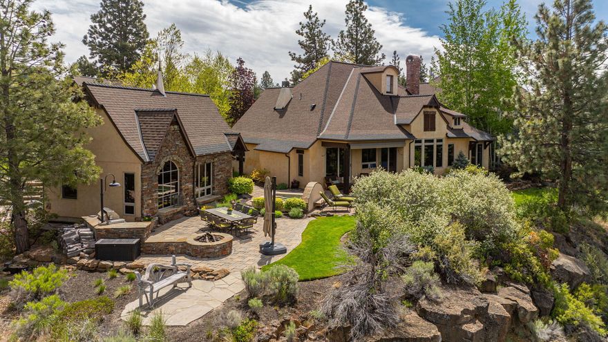 Set beautifully atop the cliffs of the Deschutes River, this multi-generational trio of structures has a total of 4702 sq feet of usable space and rests on a beautifully manicured double lot. Enjoy 180-degree bird's-eye views of the Cascades, the striking tree-lined gorge below and the winding river that meanders through it all. The primary home is a main hub, with three bedrooms, a chef's kitchen, an additional den (or 4th bedroom), office and a game room/theater space that invites gathering. The second home is an adjacent one-bedroom, one-bath single-level 'Casita' with a kitchenette and access to the custom outdoor kitchen. The third structure is a two-story one-bedroom, one-bath 'Rimessa' with a charming turret and built-in wine room. Offering enduring finishes, state-of-the-art mechanicals, dreamy custom landscaping and breathtaking sunsets, this is a truly special opportunity.