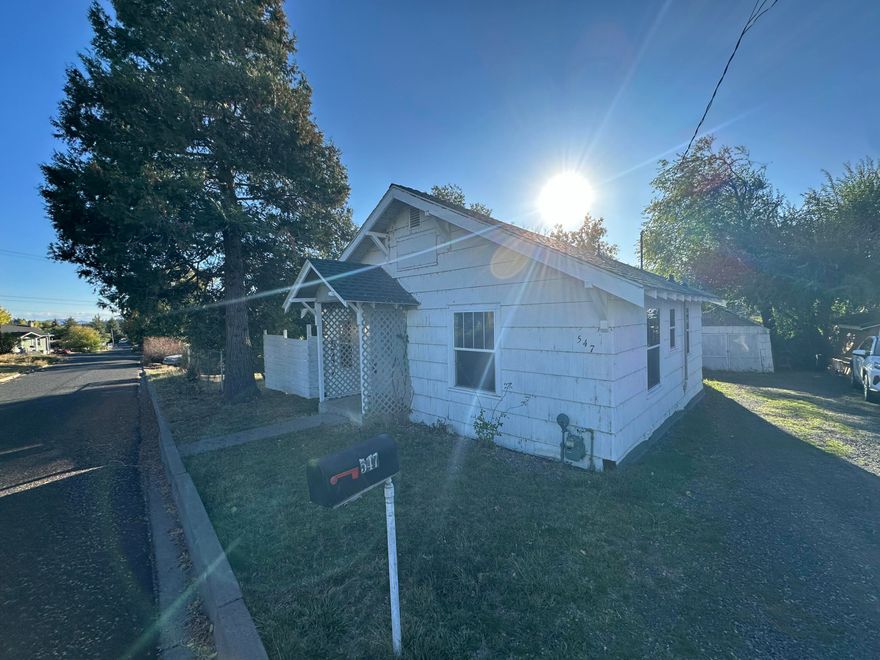 Two-bedroom 1 Bathroom 726sq/ft home with fenced yard.  Small covered patio in the back.  Small storage shed.  Easy to show.