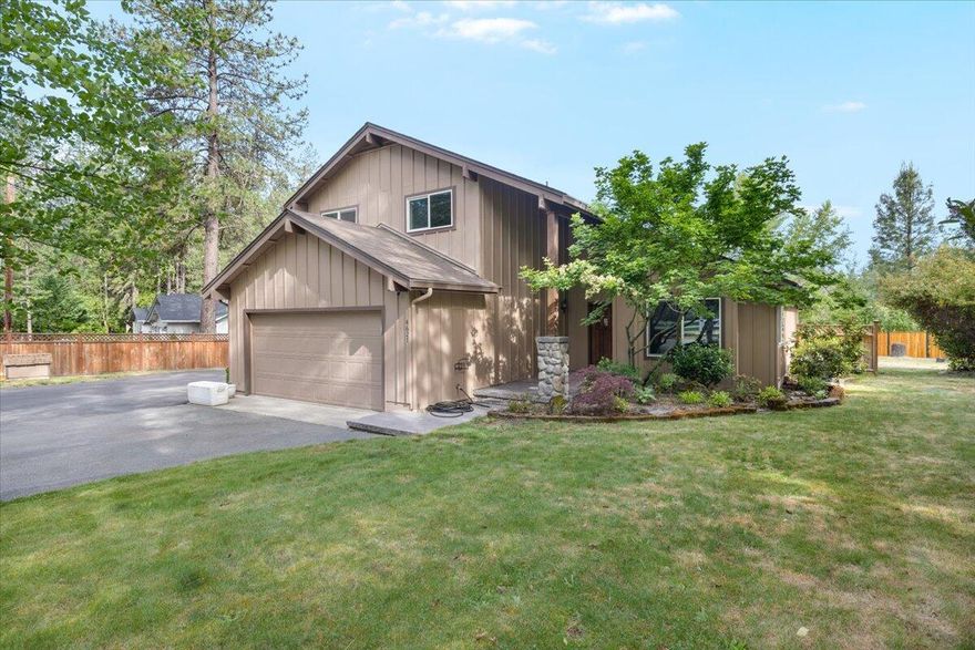 Incredible Home & Location! Just minutes to I-5, parks, schools, & downtown Rogue River, yet tucked away on a private acre with a rare blend of space, upgrades, & functionality. The massive RV barn/shop fits a 40' rig with room to spare for a shop, office, & 1/2 bath—offering versatility and multi-use options. The 4-bedroom home includes soaring vaulted ceilings when you enter, spacious living & family rooms plus a flexible space for crafts or an office. Upgrades include new asphalt, completely remodeled kitchen, lighting, tile, carpet, cable railing, subfloor & beautiful beam work, insulation, fencing, woodshed, garden, high end powder-coated cedar fencing, & improved septic access. Outside you'll find a large, covered deck, perfect for entertaining. This is a true Rogue River gem!
