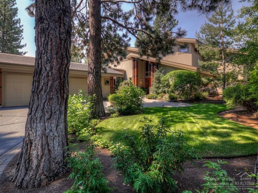 Exquisite custom home backing 4th fairway of Broken Top Golf Course. Great room w/two-story, vaulted & beamed ceiling; alder built-ins & cabinetry throughout, fir doors, radiant heat slate & travertine flooring & beautiful Mt. Bridger stonework. Master suite with see-through fireplace & patio access; hot tub & outdoor enclosed shower. Two en suite guest bedrooms, upstairs bonus room w/full wet bar & patio access, office & library area w/built-ins plus expansive guest suite/flex space with private entrance.