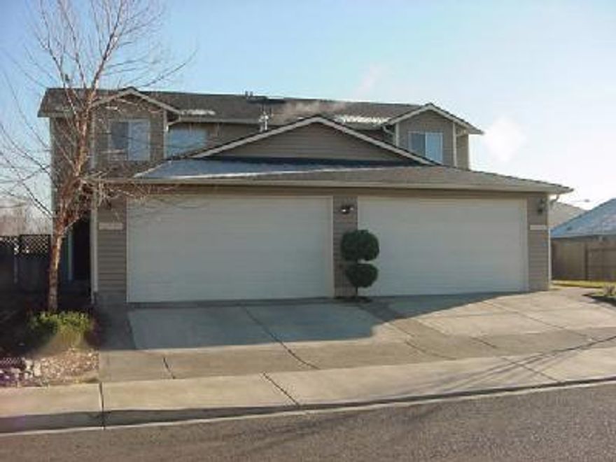Great east Medford location. Upgraded duplex built in 1998 - area of newer homes. Great investment or 2 family home. Tile counters, gas fireplace, garden jetted tub in master w/loft - separate gas and electric meters, all fenced. Listing agent to be present at all showings.