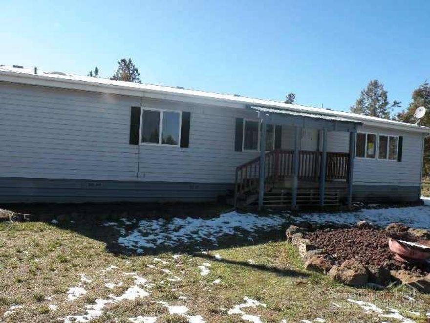 Country living with elbow room! Cute manufactured home just minutes from the Prineville Reservoir. Great room floor plan features a vaulted living room, open kitchen with center island, plus dining area. 3 bedrooms, 2 baths. Situated on an almost 2 acre lot, fenced with detached over-sized insulated 2c garage. Plenty of room for an RV and toys! This is a FannieMae Homepath property.
