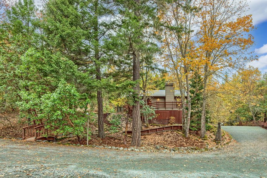 Prominently graced on a tree studded knoll, elegantly poised Custom Craftsman home with incredible views of the mountains. Walls of glass graciously invite the natural beauty and light in every room. Enter a Foyer of elegance and craftsmanship with crown molding and attention to detail. Leading to an airy family room with a cozy fireplace with spectacular views and ambiance. The sunlit Chef's kitchen includes high end appliances with Italian tile counters that leads to an elegant dining room and airy walls of glass to take in the great outdoors. Enter a dreamy Ensuite with views of light and romance. This can be a 2 family home, the bottom floor has a kitchen, full bath and 2 to 3 bedrooms with lots of room for whatever your needs. The top floor has 2 bedrooms and 2 baths with a wrap around deck to entertain and enjoy the great outdoors with a waterfall and beautiful landscaping, playground, hot tub and barn on 5.04 acres of tranquility. Make your appointment today before this is gone