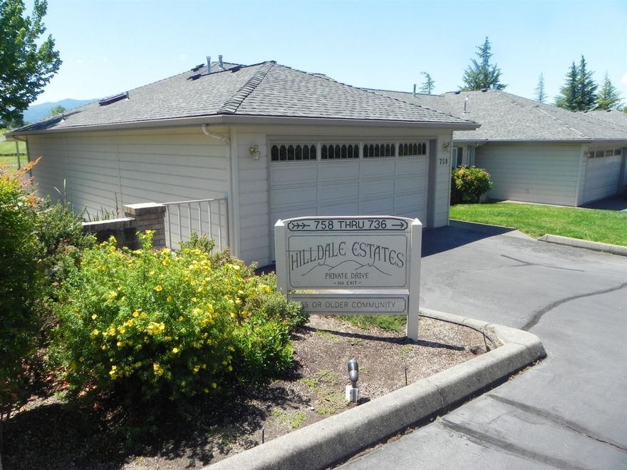 Hard to find, single level, town home in Hilldale Estates, a 55+ community. This is an end unit which adds privacy to the covered deck overlooking Quail Point Golf Course and beyond to Mt Ashland. Big windows in the great room let in lots of natural light and the amazing views. Vaulted ceiling and gas fireplace complete the living area. The master bedroom offers a light filled bathroom with step in shower, walk-in closet and slider to the deck. The second bedroom and bath are convenient for guests. Kitchen features good quality oak cabinets with spice cabinet, lazy susan and plenty of space. Lots of good storage areas. HOA includes driveway, roof, exterior paint, landscape maintenance, sprinklers, outdoor lights and water. Downsize to this extremely cute, efficient home.