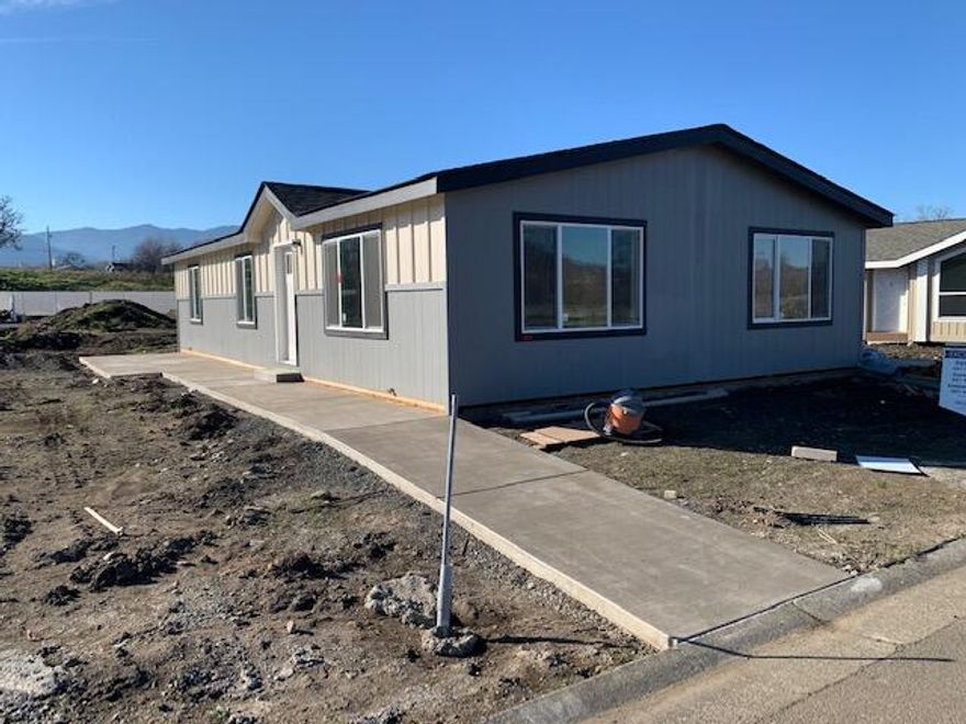 Here's a new listing #87 in popular Mountain View Estates, a 55+ community.  Mountain View Estates is still owned by the local family that developed it in 1987. 21 homes of the 164 homes survived the Alameda Fire of 2020.  The park is being restored & is now welcoming new and returning residents to this vibrant community.  There's a brand-new dog park and mailbox kiosk with parking at the entry. This brand-new Skyline 2 bedroom, 2 bath home is just the right size & the right floor plan if you're looking for 2 bedrooms plus an office.  The large master bedroom runs across the back of the home.  Double vanity in the bathroom with a generous linen closet too. The kitchen & living area are in the front with views of the neighborhood.  There are plenty of counters & cabinets to please the cook.  You've got plenty of space for your cars under the carport.  Vinyl fencing & drought tolerant landscaping included along with sewer & trash. One small pet up to 25 lbs allowed. Interesting?  You bet