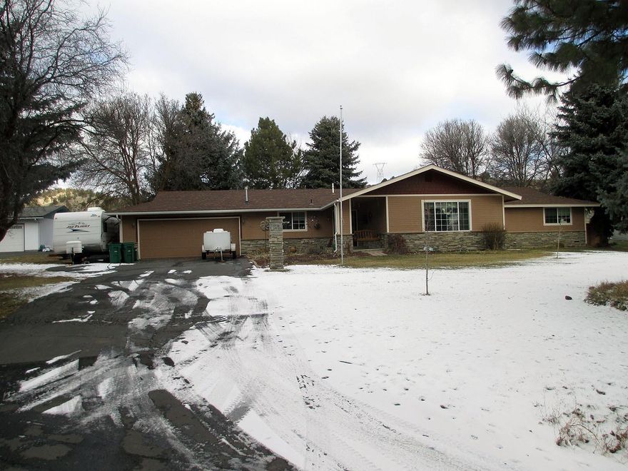 This updated over 2800 sq foot home boasts 4 bedrooms and 3 baths. With entertaining areas inside and out! It sits on over 1/2 acre! Separate entrance on property to large 21 x 40 shop with a 12 x 40 carport on each side of the shop! Plenty of room for toys, garage is 24 ft wide and 25 ft deep, inside has separate den and entertainment areas, also includes beautiful deck and hot tub with gazebo, and a play house! it sits 2nd from the end of a dead end street, A must see, make an appointment today!