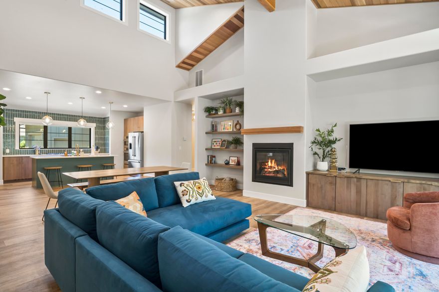 Enjoy refined living in this beautifully designed home set within one of Sunriver's premier golf course communities. Soaring ceilings and expansive windows define the open-concept great room, creating a bright space for entertaining or relaxing. The gourmet kitchen features quartz countertops, designer tile, and premium stainless appliances. The luxurious primary suite includes a spa-like bath with soaking tub and walk-in shower. Two additional bedrooms offer flexibility for guests or a home office. Step outside to a covered patio and private yard. The spacious 856 sq ft garage includes an attached gym/studio—ideal for workouts, hobbies, or creative projects. Just minutes from Sunriver's trails, SHARC, and Village amenities, this home blends modern comfort with resort-style living—perfect as a full-time residence, vacation getaway, or investment. Furniture and bikes are included in the sale. Excluded items are the artwork and paddle boards.