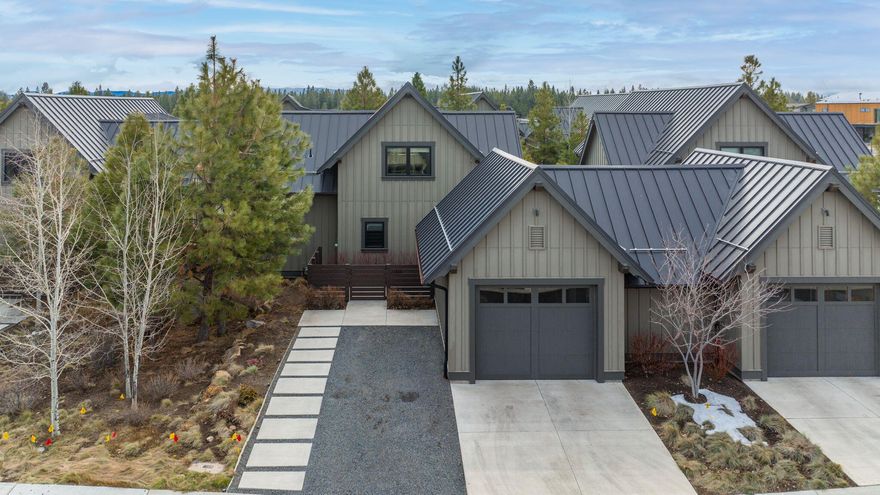 The outdoor enthusiast's dream location! Experience the true Bend lifestyle directly from your front door step: Moments to epic trail systems, less than 20 minutes to Mt. Bachelor and just a short walk to Tetherow pools, fitness center, clubhouse and dining options. Built by the highly-acclaimed SunWest Builders, this Mountain Modern Tetherow Cabin offers high-end finishes throughout and an efficient, immaculately maintained floor plan. Great Room features warm wood accents, beamed ceilings, access out to side patio area and a stunning gas fireplace to cozy up to aprés ski. Chef's Kitchen offers solid surface countertops, stainless appliances, and ample seating at the extensive bar. Main level Primary Suite with luxurious tiled shower and dual vanity. Main level laundry + ½ bath. Upstairs: Oversized 2nd BR w/plenty of space to also serve as bonus/media rm, full bath + additional loft flex space ideal for home office or gym. Separate 1 car garage w/extra storage for all your Bend gear.