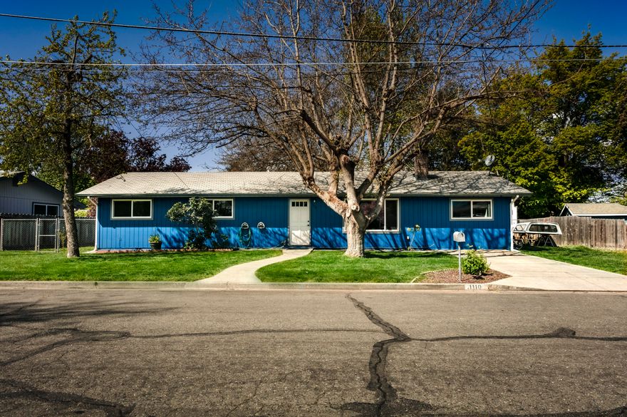 This Single Level Home on .17 acres is one of those ''Must SEE '' homes to Appreciate the Character and Charm it offers. Located in a Quiet Safe neighborhood on a cul-de-sac. In walking distance to Parkside Elementary, Reinhart Volunteer Sports Park and the Famous Rogue River! When you walk through the door it just has that ''I Am Home'' Feeling :) This is a 3 Bedroom 2 Bath home with a Large Bonus room that can be used as a 4th Bedroom , Game room or Man Cave .The Living room has a Unique Gas Fireplace and Gorgeous Flooring Throughout . Each of the Bedrooms have wireless remote controlled ceiling fan/lights. Beautiful lawn, giant shade trees in the front and backyard, 4 fruit trees, an inflatable 4 person jacuzzi on the back covered porch with a beautiful view of the outdoor wood burning fireplace and Koi Fish Pond. RV parking as well side entrances to the backyard from both sides. Large Kitchen with plenty of sunlight throughout this home. Priced to sell fast. Easy to Show !!!