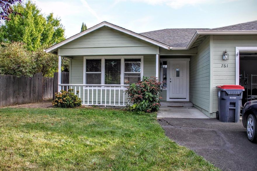 Built in 2002 and lovingly maintained, this home has over 1360 square feet of living space with three bedrooms, two bathrooms, vaulted ceiling in living room, and an open floorplan with a cute corner kitchen that has LOTS of cabinet space. Wood blinds throughout. Seller has just had brand-new carpet & pad installed throughout home and also has had exterior freshly painted. Back yard features a huge covered and screened-in patio, plenty of grass, garden beds along all the edges, and a nice-sized gravel pad once used for above-ground pool but now used as additional seating area. Front yard has mature landscaping including a big plum tree, hostas, a bleeding heart, and hydrangeas, and even a white front porch to round out the curb appeal. Attached double garage is also newly finished with sheet-rock panels. Nestled at the end of a flag lot and backing up to a designated wildlife preserve, this area is very quiet and traffic is low. All appliances negotiable. Showings by appointment only!