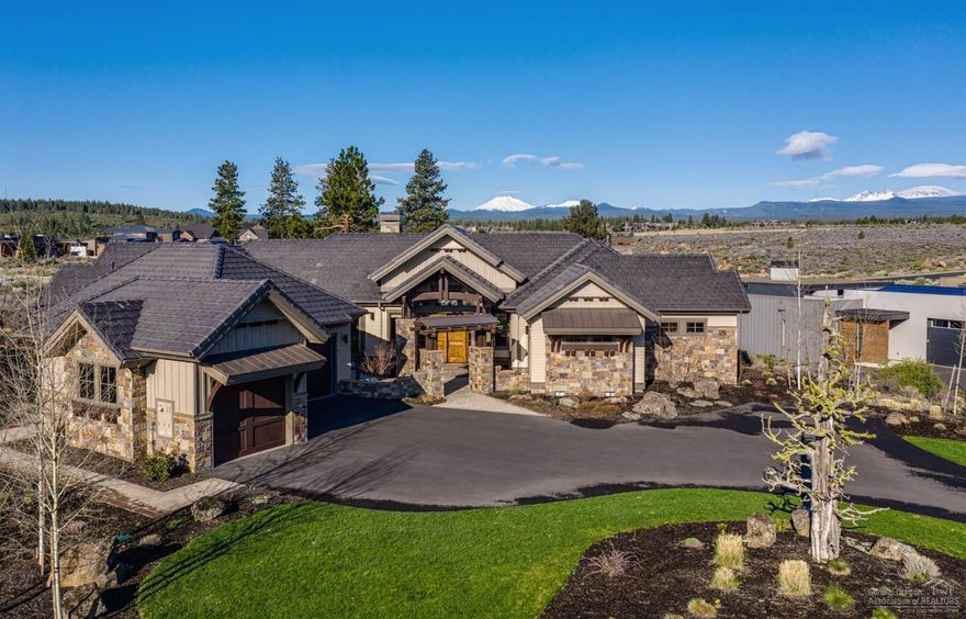 Exquisite single-level custom home with sweeping Cascade views lives beautifully. At the heart of the home is an impressive great room with a true masonry double-sided stone fireplace, rich walnut, maple and knotty alder accents, and 20-foot vaulted ceiling. The fabulous chef's kitchen is an entertainer's delight, offering quartz counters and a large slab granite island with storage, 2 dishwashers, 2 wine fridges, hand crafted cabinets, and an inviting dining area adjacent to the fireplace. Four spacious bedrooms (3 en suite), including a beautiful master suite with fireplace, silver travertine tile, and huge custom tailored walk-in closet. Wonderful covered patio for viewing blazing sunsets, relaxing and entertaining. Oversized triple garage with storage, award-winning landscaping. Backs to open space.