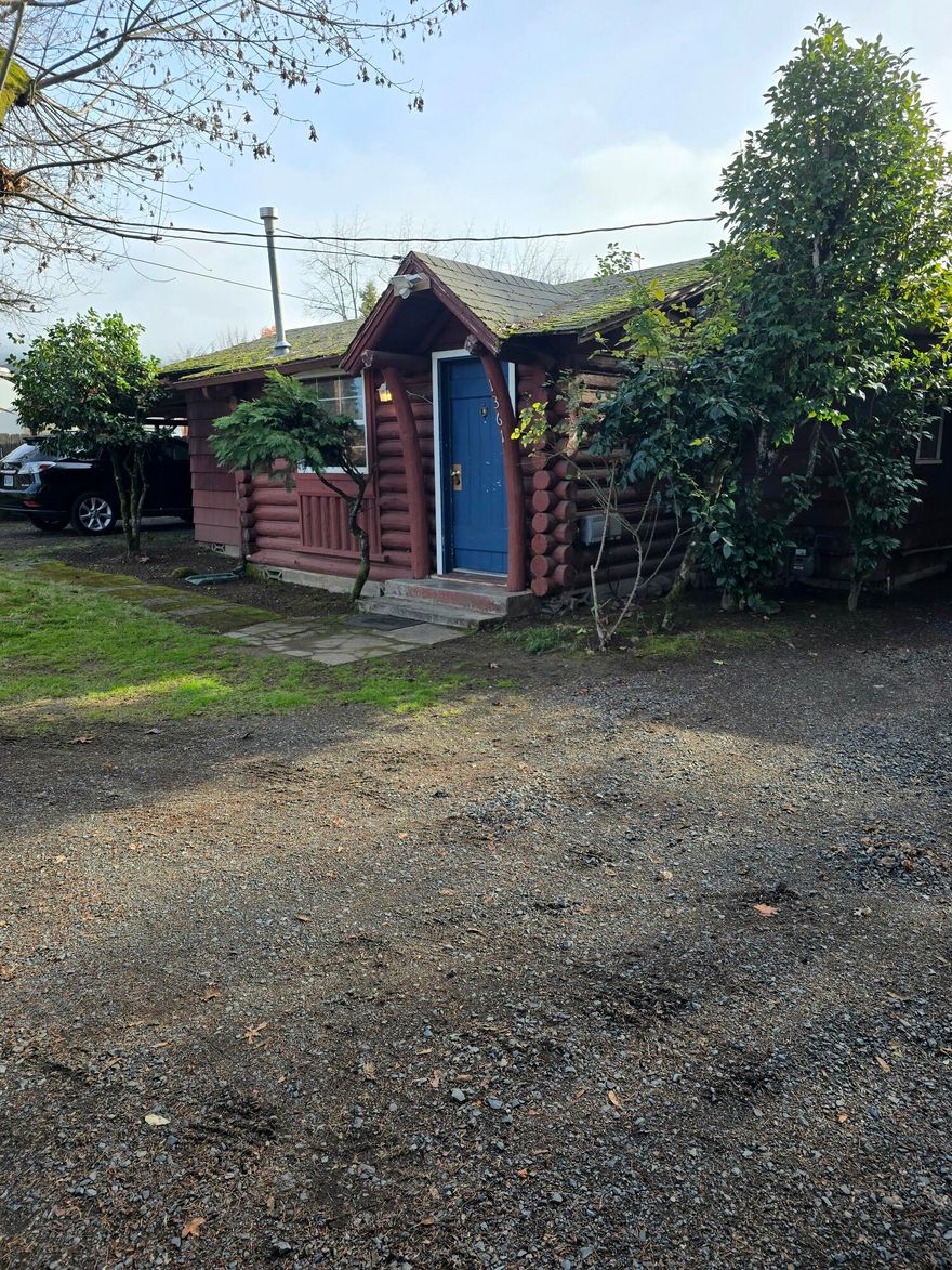 Investment opportunity on level .29 of an acre in Fruitdale area of Grants Pass.  Two homes and both feature 1 bedroom and 1 bathroom.  Cute cabin with attached carport and back patio.  Second home has spacious sunny and bright kitchen.  An attached garage with 2 car carport.   Shared well between 2 homes and City Sewer.  Check with City/County for further development on this lot. Professional photos to come.