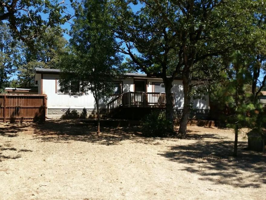 This home offers 3 bedrooms, 2 baths. Forced air heat and a/c (heat pump) plus a free standing wood stove. Newer roof, front and rear decks. Home sits on a large .76 acre lot with a huge fenced front yard. The back of the property offers a nice view of the mountains. Plenty of room for extra parking or even a garage or shop!