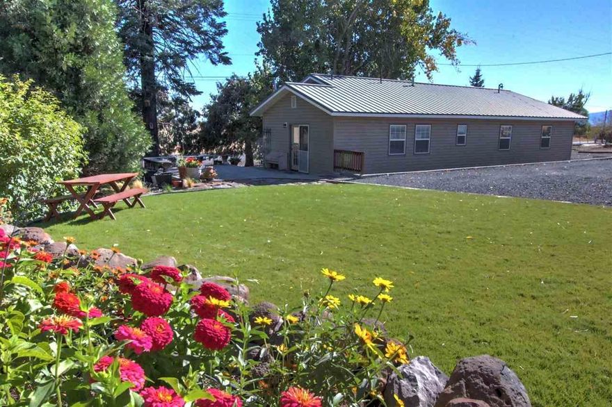 Looking For A Nice Home On A Fenced Acre Close To Town? Beautifully Maintained Fenced Small Acreage. Ample Parking Including Room For R.V. Detached 2 Bay Garage/Shop With Attached Office. Friendly Farmhouse Style Home Has Built-ins By Borror And Kitchen Cabinets By Leach. Well Appointed Kitchen With Subway Tile Back Splash And Recent Upgrades, Laundry In Service Porch Plus Extra Storage. Deck Surrounded By Established Landscaping. Crown Moulding. Water Spigots Dot Property For Ease Of Watering.Established Raspberry Patch. New Well Pump In 2014 With Additional Hand Pump In Case Of Power Outage. This Lovely Home Is Easy To Show And Appreciate