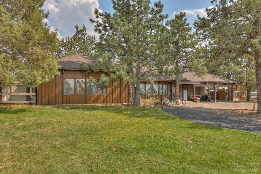 Panoramic views of the Cascades & Barnes Butte from this rustic ranch style home. 2 acres of personal space is fenced & cross fenced w/round pen. Open kitchen & dining adjacent to living room & is set up perfect for entertaining. Tongue & groove ceilings w/exposed beams, bead board walls & a claw foot tub in the Master bath. Tons of windows throughout! Enjoy stunning sunrises & sunsets - bring your horses & toys!