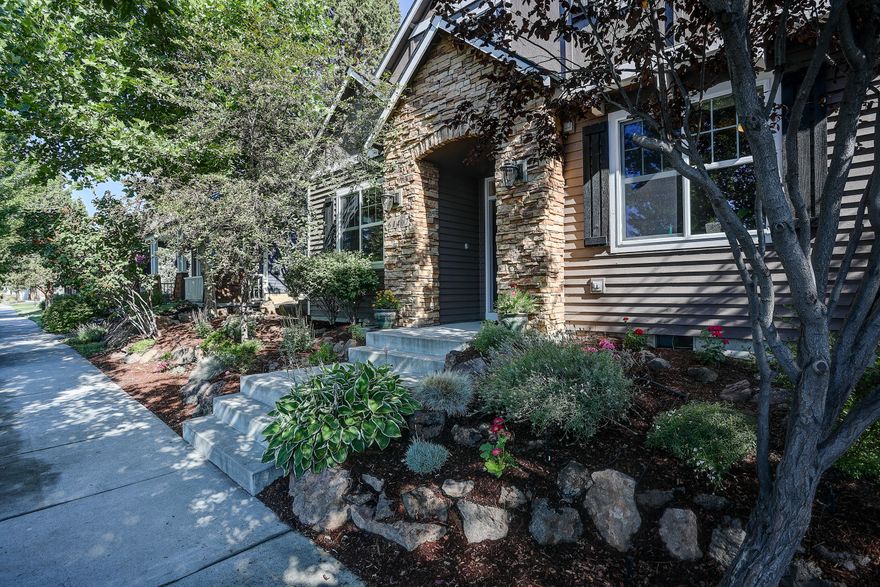 This beautiful home is in SE Bend's Foxborough neighborhood. Large open living area with fireplace leads into the updated kitchen. All appliances have been upgraded with motion activated faucet, upgraded garbage disposal, hot water dispenser, and dishwasher. The upstairs bedrooms are all extremely spacious with bonus room with additional storage. The master bath has been tastefully upgraded. The backyard is extremely well maintained with a hobby garden and landscaping throughout. This property also features a 3 car tandem garage for all your toys, vehicles or extra room for a workshop. Pride of ownership is evident throughout.