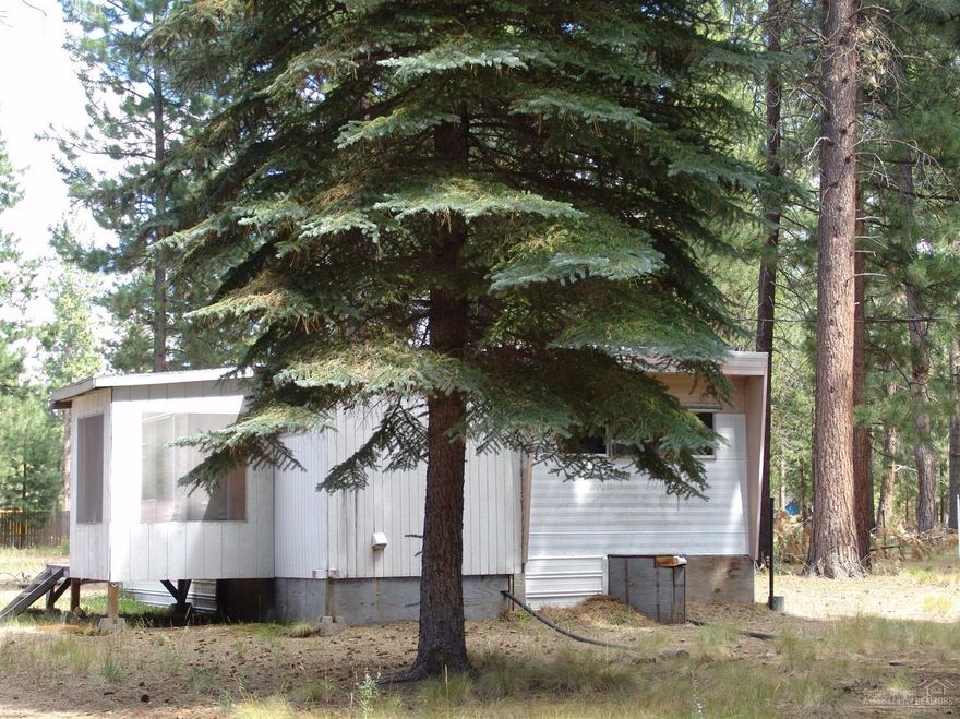 Come check out this property!! Really Nice Lot .97 + or - Acres. Partially Fenced! Sold As Is Where Is! TLC needed but in a great location and priced to sell! Older Mobile may not be livable. Several Out Buildings Great for a tear down and start over! (Check with Deschutes County Community Development) Buyer and Buyer Agent to do all due diligence on property, Septic, Well and Electrical Service! Close to lakes, rivers and all that Central Oregon has to offer. Bring All Offers!!!!