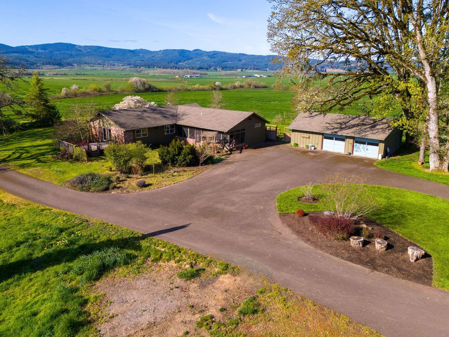 This property is 127 acres total w/ 90 acres tillable, and 27 acres planted in vineyards. The location is tucked away down a half-mile-long paved driveway in a private area with views of the surrounding valley. The property has multiple outbuildings, with the largest being a 120' x 40' shop that comes with a massive 3-ton overhead crane powered by 480 amp service wired for 220 and 110 outlets throughout. The finished 60' x 46' workshop is drywalled, has a heat pump and is wired for all of your projects. The 2nd building has finished studio space, and the 3rd barn has an expansive deck perfect for entertaining.
The various barns and shops are set up for all your projects, tools, toys, and needs!