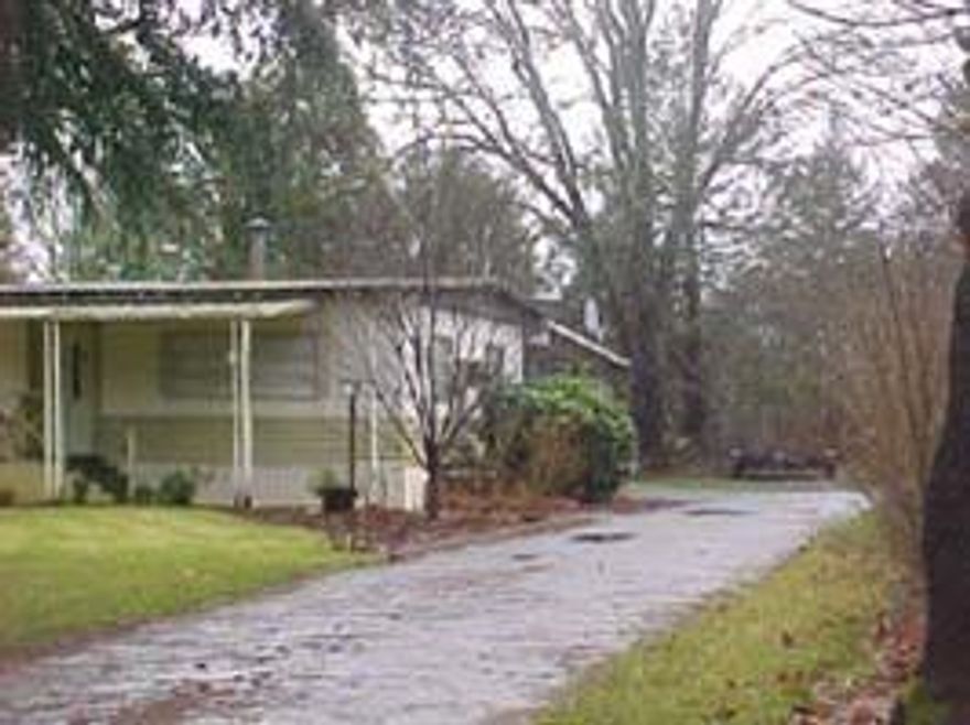 BEAUTIFUL LAWN, NICE SHADE TREES, ALL SERVICES ARE IN - READY FOR YOUR HOME OR MANUFACTURED HOME. HAVE A SPRINKLER SYSTEM IN FOR FRONT ONLY. THIS HAS AN OLDER MOBILE - VALUE IN IN THE LAND. SELLING AS A BUILDABLE LOT ONLY. 2 STORAGE BLDGS. WITHIN 3 BLOCK RADIUS OF STORES, PARK & SCHOOLS.