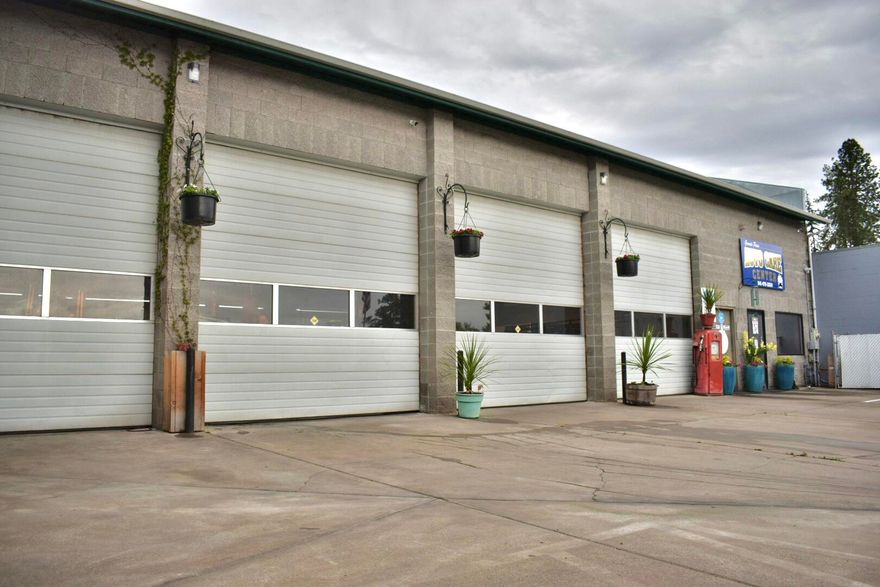 Excellent property location and currently a thriving Automotive business for sale in the heart of the commercial area of Grants Pass. Run the business or plug your own into it! Big 4 Bay shop with excellent lighting and tidy office area with its own customer area and bathroom. Separate break room includes a mini kitchen and employee bathroom with shower. Heated (waste oil and heat pump) and cooled! (AC system and new swamp coolers).  Upstairs storage or turn into another work area. Gated concrete parking area in front.  This listing price is for the property only, but the business and equipment are for sale as well.  Some equipment is included with the property.