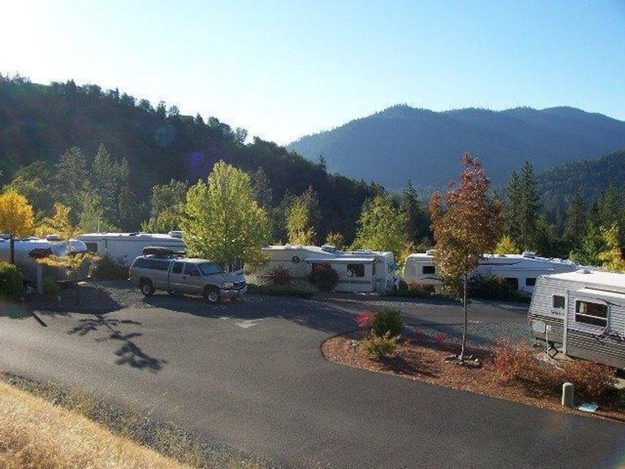 50 RV sites all with 20/30/50 amp service. 4 sites no sewer hookup, 46 sites with full hookups. Sites all have cable TV, WIFI, sent out thru park RV Pump station. Sand filter septic system 9 septic tanks. All computerized leach field has individual zones for dosing. 2 wells and 1000 gal underground storage tank. Laundry room with 3 washers and 3 dryers, also has 3 private restrooms with showers. Small pond, maintenance shop. Two separate parcels zoned RR5 with use listed as park. One parcel is 5.11 acres the other parcel is 5.42 acres per county assessor. Undeveloped parcel has nice building pad with views. Park is within walking distance to Rogue River and Pearce Park.