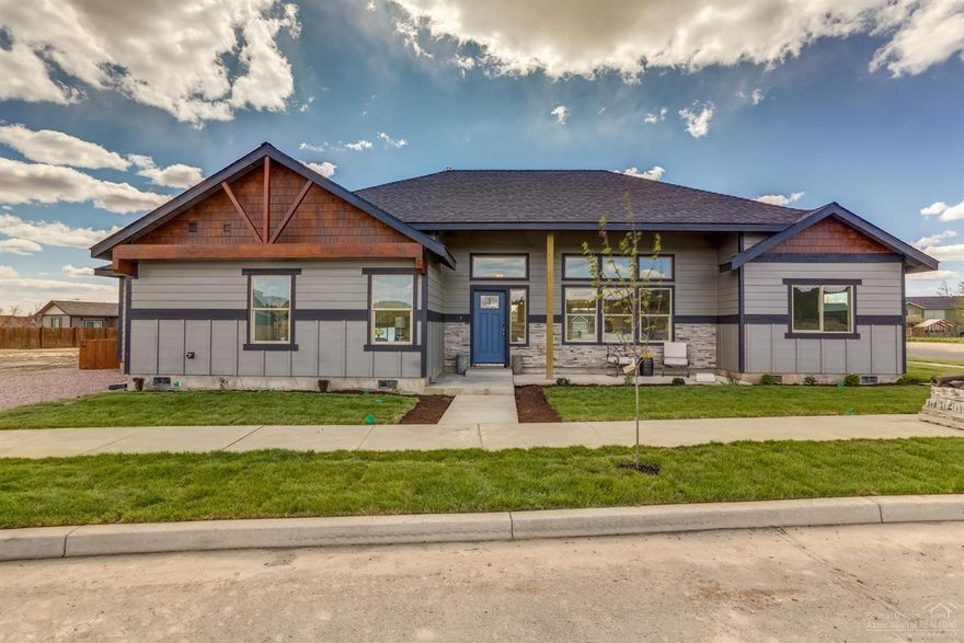 Two master suites is what sets this single level home apart from the rest. This gorgeous custom home sits on a corner lot in the upscale neighborhood of Ironhorse. Enjoy the picturesque Central Oregon landscape and views of Barnes Butte from the front porch. Entertaining is easy with the open living space and the double oven will make cooking for a crowd a breeze. The kitchen features two-tone cabinetry, marble backsplash, Kitchenaid appliances and quartz countertops. With a total of four bedrooms and three full bathrooms, there is room and privacy for everyone. You can expect lower utility bills due to the Earth Advantage Certification, which guarantees energy efficiency, healthy indoor air quality, and water conservation, among many other benefits. Don't let this one pass you by. Contact your preferred real estate professional and schedule a tour today.