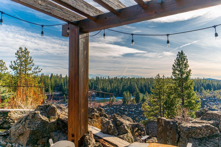 This spectacular, luxury townhome boasts four distinct bedroom suites spread across over 3000 sq ft of interior living space and is perched above the Deschutes River and Lava Island.  Set behind the home is an expansive paver patio, outdoor fireplace, built-in BBQ, separate sitting area with pergola and water feature with breathtaking river and treetop views. Adjacent to the generously sized dining space is a sun-drenched great room anchored by a stone-clad fireplace.  The kitchen features a 6 burner Wolf range, chiseled edge granite countertops, Alder cabinetry and breakfast bar. The primary bedroom suite tucked just behind the main living area offers secondary access to the outdoor living area.  Upstairs features three additional guest suites with ample separation between each. An oversized two-car garage, dual zone HVAC, exterior maintenance covered by the HOA and easy access to the Deschutes River Trail round out this rare offering in the community of PointsWest.