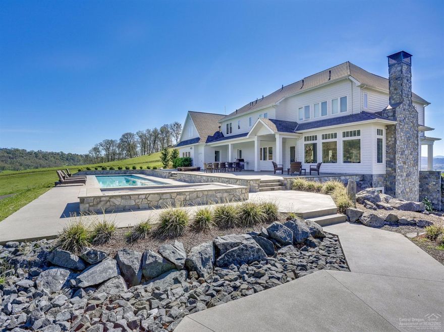 A custom home with views of spectacular sunrises & sunset, overlooking a private golf course, the Callahan Range & rangeland. This home was built with high quality materials from the US and Europe only and takes advantage of the stunningly beautiful views. The home features 5 bedroom suites, gourmet kitchen w/miele appliances, basement w/living area, storage & workout room. Outdoors you have a olympic size pool, a 10 person hot tub.