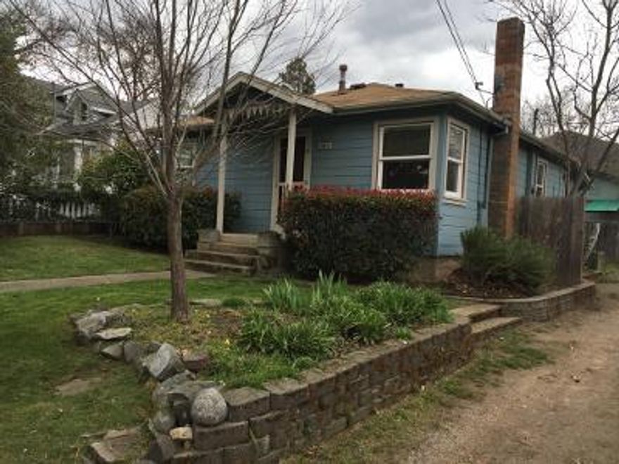 Opportunity awaits you with wonderful flat lot with two homes separated by fence and storage unit (old garage).  Each home is one story.  303 Garfield is a 3 bedroom, 1 bath charming 1940's home with built ins, gorgeous wood floors in living room and 2 bedrooms. Newer vinyl windows, ceiling fan, washer/dryer and 3rd bedroom has carpet.  Nice front and side yard.  Tenants just moved out and the rent was $1300.00 per month.  307 Garfield is a cute 2 bedroom, 1 bath with eat in kitchen, washer/dryer, newer vinyl windows and central AC.  Alley access and driveway parking.  Home is approximately 816 square feet with front, back and side yards.  Currently rented under market at $1100.00 on month to month tenancy.  The homes have separate utility meters and wonderful privacy.  Live in one and rent the other or rent them both.  Professional pictures coming soon.