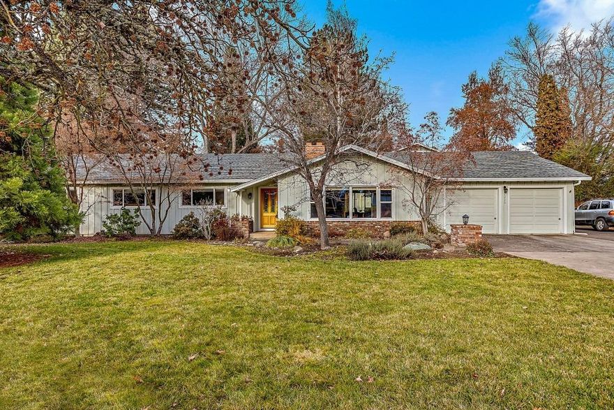 Shop.HUGE 40ftX36ft shop with over 20ft ceilings and loft area with office. 18ft high 16ft wide door so large RV's can be parked inside. Plumbed with air compressor, water and gas heat. Oh! And there's a very nice house as well. This lovingly cared for home boasts 4 bedrooms, 3 baths, lots of oak hardwood flooring and 2 gas fireplaces. The kitchen is quite spacious and features granite counters, a large gas cook-top stove and other upgraded appliances. The formal dining room has a wet bar and there are several built-ins throughout the home. The guest bath has been remodeled and features a handicap friendly shower. Master bedroom was added onto years ago so there is an office/sitting room in addition to a huge bedroom with vaulted ceiling and large walk-in closet. This all sits on a nearly half acre lot located near Hoover Elementary and Rogue Regional Medical Center.