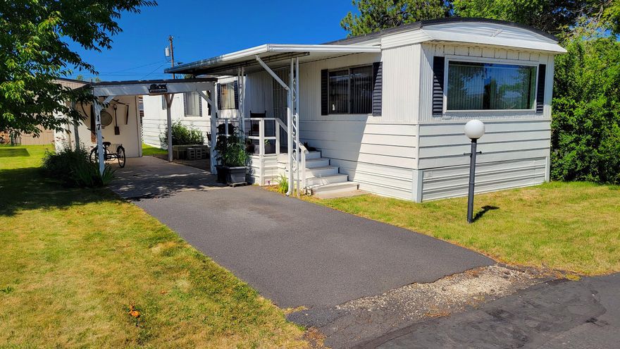 Spacious 2 bedroom 1 bathroom home in Terrace Mobile Plaza, an all age mobile home park! This home features 938 sqft of living space, has a carport to park under, and a storage area outside as well. The step up living room is good sized and overlooks the kitchen and dining area. Home has a newer roof, new roof on the carport, and a new water heater, all appliances included! Give us a call for a showing!