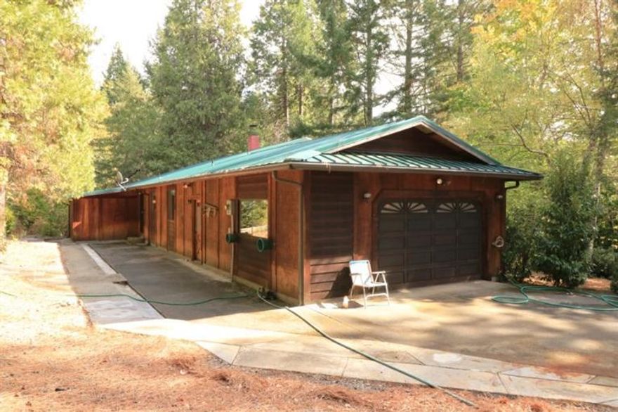 Call it home on King Mountain Trail in Beautiful Sunny Valley! Built in 1989 and well maintained, this solid one level ranch style home enjoys amazing views, and 18.75 acres of open space, tall trees and off the road privacy! Covered front porch for those lazy afternoons, large Great Room for family enjoyment. Kitchen with island and door to the back patio, inside Laundry, and two Bedrooms, two baths and an attached two car garage. Multiple outbuildings including an RV port, carport, equipment storage, garden area, gated entrance, well with extra storage tank, septic, yard light, hose bibs and fire hydrant, with Slagle Creek and Benjamin Gulch meandering through. Just minutes to Merlin and Grants Pass and easy access to I-5, you'll enjoy driving through the historic Covered Bridge as a reminder of the special place you live in Southern Oregon.