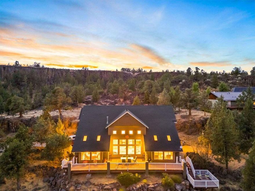 Expansive Estate Home on 5 beautifully unique acres with incredible rock outcroppings & sweeping views of the Valley, Ochoco Mountains, & City Lights. This stunning home offers space, elegance & flexibility; just a short drive to Prineville or Redmond. Inside, you're greeted by grand two-story ceilings & floor-to-ceiling windows that flood the living space w/natural light. The spacious main-level primary suite provides a peaceful retreat with scenic views. A large office on the main floor could easily serve as a 5th bedroom or hobby room; ideal for multi-generational living. Upstairs, you'll find three additional bedrooms, along with a loft area. Step outside to the expansive multi-level deck: ideal for relaxing, entertaining, or soaking in the Central Oregon sunsets. The deck is hot tub-ready w/hookups. Room to build a shop & a private yet accessible location, this property is a rare find. Looking for a peaceful getaway or a home close to town w/room to grow, this has it all.
