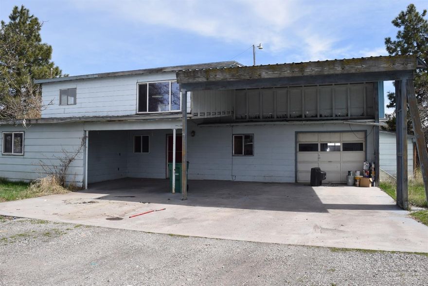 Large 3 bedroom home on over sized fenced lot! This home features large living areas both upstairs and down, open concept kitchen, bonus room/office, single car garage, separate mud room/laundry room and a wood shed! Endless opportunities!