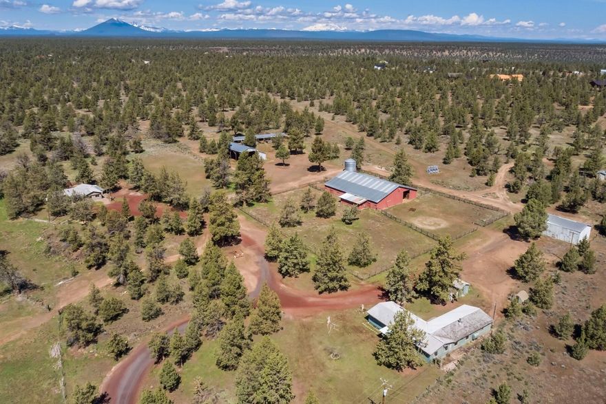 Terrific location between Redmond and Sisters, this 62 acres is zoned Rural Residential RR 10 (10 acre lots). Development Potential with the Legal Lot of Record approved and the potential to split 10 acre lots and keep the home/out buildings on a lot, Buyer would be responsible for due diligence with Deschutes County on requirements for future development  With a history of an equestrian training facility, the home and buildings could be split from acreage. Two Homes: 1745 sq ft 3 bedrooms, 2 bathrooms home and 2 bedroom, 2 bathroom home that has been used as a farm hand dwelling. Property includes: Barn is 100x200 with 10 stalls, tack room, office/meeting room with full bathroom. Hay barn with attached 10 stalls, silo, equipment shed and livestock shelter with runs. This property is a wonderful opportunity to build your dream in the hear of Central Oregon.