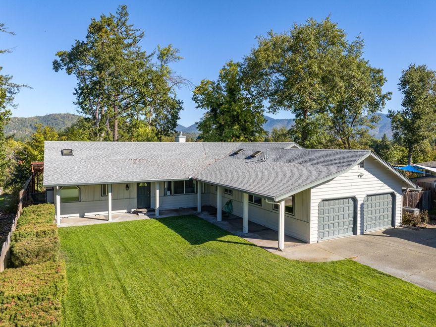 Riverfront living on the Rogue! This 2,485 sq ft home sits on nearly half an acre at the end of a quiet cul-de-sac with high-bank frontage and stunning river views. The spacious layout features hardwood floors, an open kitchen with island and walk-in pantry, and a formal dining area. The large primary suite includes an ensuite bath with walk-in shower and jetted soaking tub. Each bedroom offers a generous walk-in closet. Step outside to enjoy a new deck overlooking the river, hot tub with incredible views, stamped concrete patio, and GPID irrigation. A 26 kW Generac generator with 5-year warranty adds peace of mind. The expansive front yard and serene location make this the ideal setting to experience Southern Oregon's natural beauty.