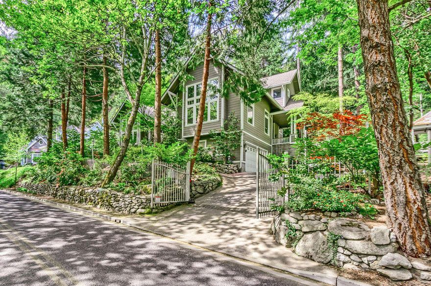 Well cared for home in a prime location by Lithia Park.  Hickory floors accent the primary living areas including the well-appointed kitchen with granite, stainless appliances and storage galore. The adjacent dining nook and vaulted family room with fireplace provide great spaces to engage w/ company while preparing a meal. The grand living room has picture windows & floor to ceiling fireplace. The formal dining room overlooks the park like backyard, complete with rock walls, mature landscaping & incredible privacy. Entertaining in this home is a delight. Numerous sitting areas bring the outside in. The front courtyard has fireplace & is a wonderful spot for taking in Lithia Creek. There is a bedroom & full bath on the main level. Owner's suite is upstairs featuring a private balcony, sun-filled bathroom w/ dual vanities, tile shower & soaking tub. Conveniently located on the lower level is a overflow storage room, great for a secondary home office, addtn'l pantry, wine room or more.