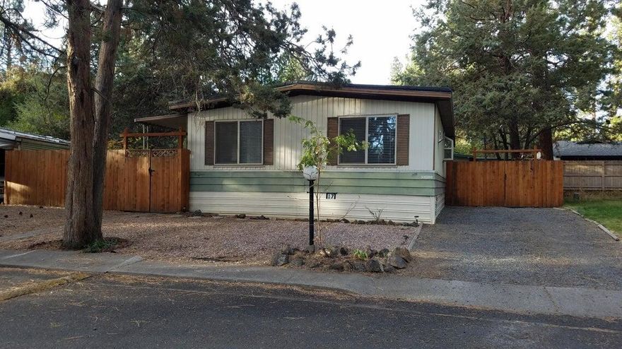 Location! Location! Location! Located on Bend's West Side, across the street from the OSU Campus, this 1152 sq ft Mobile Only, has 2 bedrooms and 2 baths, home is light and bright, has lots of windows, a large living room with propane stove, a huge kitchen with eating bar and island, large pantry, lots of cabinets and storage, dining room, large primary suite with large closet, double vanity, stall shower and storage, and good separation from the other bedroom, appliances are included. Relax in the huge private fenced backyard too, all in Walking Distance to Stores, Shops, the New OSU Campus, Eateries and all the West Side has to offer. Space Rent is $500.00 mo, includes water/sewer, trash, and removal of yard debris. Buyer must be approved to West Side Pines Co Op, Owner Occupied Only. Did I mention Location! CASH ONLY. Make an appointment to view!!