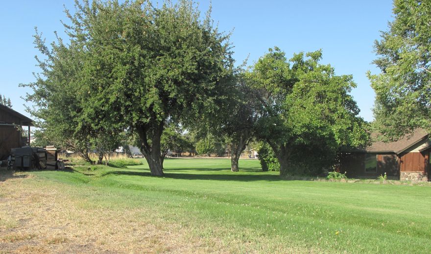 Highly valued R5 development ground in a large enough parcel to meet any need the zoning allows.  High density uses outright includes 24 units/acre including multi-family, condominiums,  residential care and home facilities and more.  Conditional uses include cottage and cluster development, nursing and convalescent and assisted living facilities, planned unit development, churches and more.  This is one of a few large R5 parcels in Redmond.  Buyer to confirm their use with City of Redmond.  Access to 3 public streets, 21st requiring development.  Public sewer/water is stubbed onto the property and fire hydrants available in 2 streets.   Power, cable and natural gas also available.  Property has a 3 bedroom, 1 bath home and a storage shed that is considered of no value for purposes of this sale. This portion of Redmond is in an Opportunity Zone.  Short walking distance to various major shopping.   CLA to show.